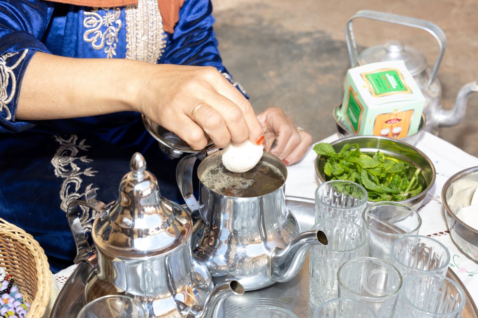 Traditional Moroccan mint tea being prepared for guests